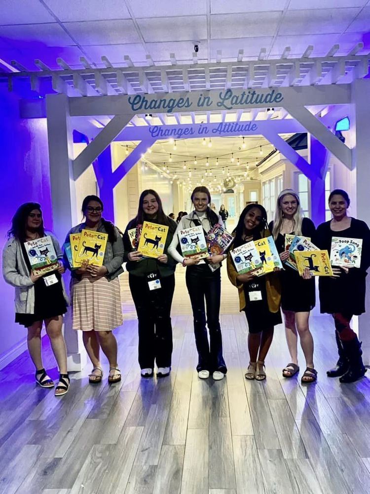 students holding Pete the Cat Books